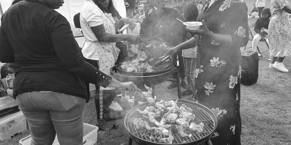 people making a barbecue in the park