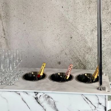 Champagne cart with glasses.