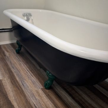 Antique clawfoot tub restoration. We saved this iron tub by repairing modern refinishing coat.