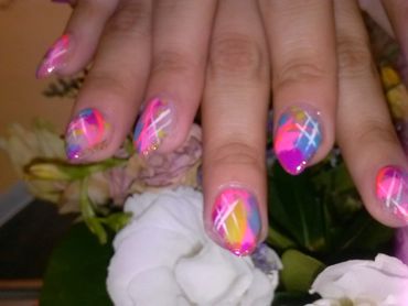 Nail decorating on the spot with designs on the fly.