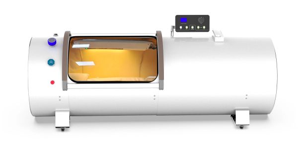 White hyperbaric oxygen therapy chamber with control panel.