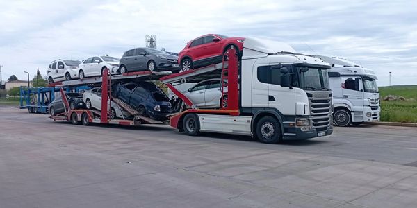 A truck transporting multiple cars