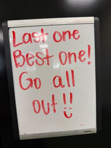 Motivational message on a whiteboard with red marker.