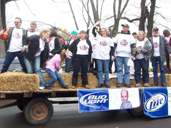 Parade float carrying a group of people.