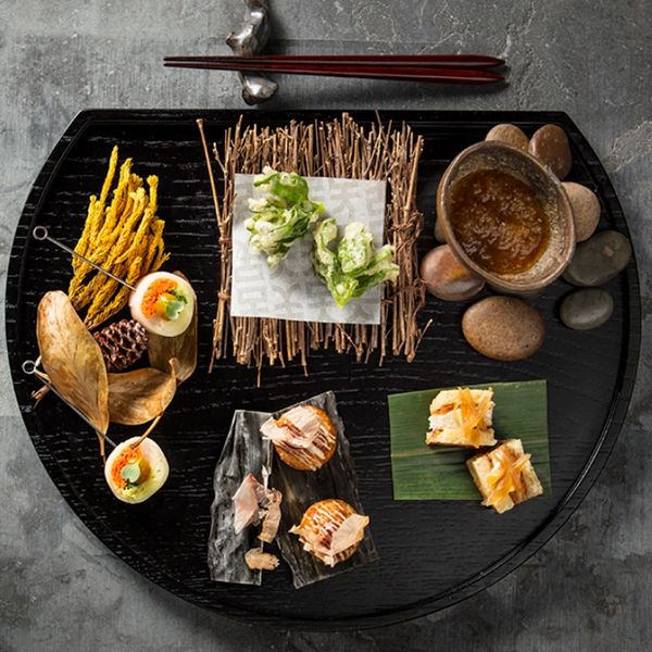 Creative food presentation on a black plate