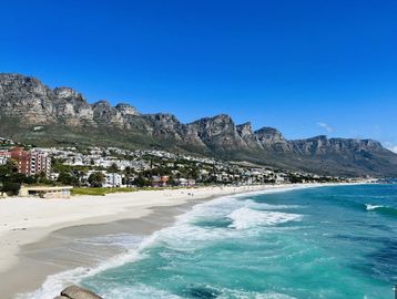 Long beach with hotels, and mountain in background