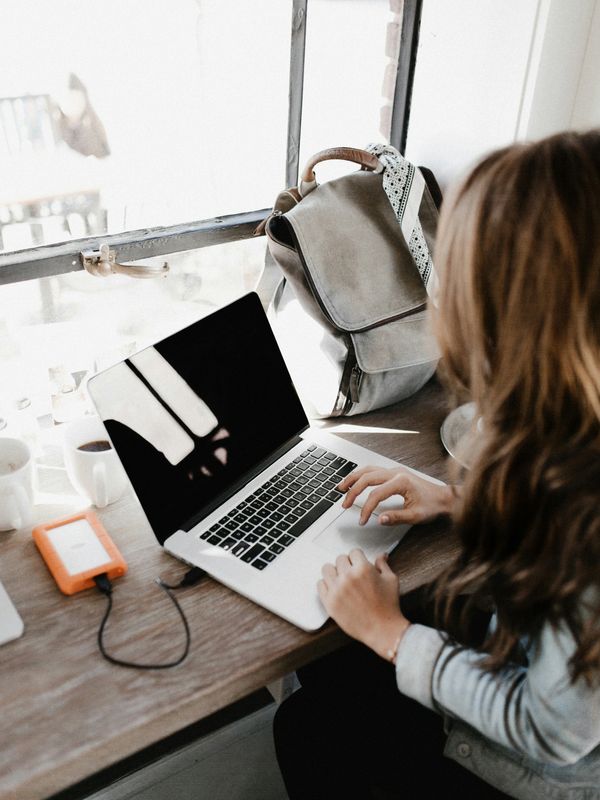 Woman at desk looking at computer