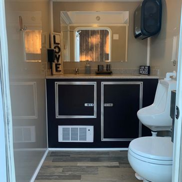 interior view of a luxury portable restroom stall
