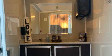 view of a decorated counter inside a restroom trailer