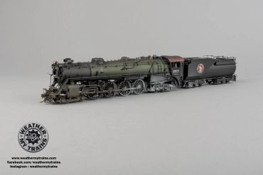 Detailed model of a vintage steam locomotive with a tender car.