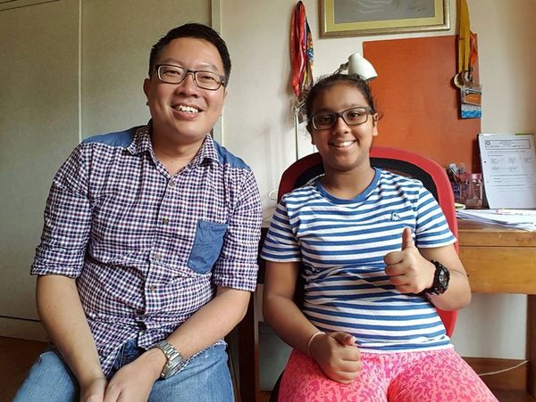 Our Primary Math Tutor posing with a Primary 6 private student after a PSLE Math Tuition class.