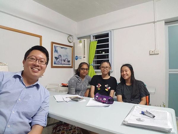 Our Primary Math Tutor posing with a Primary 6 group of students after a PSLE Math Tuition class.