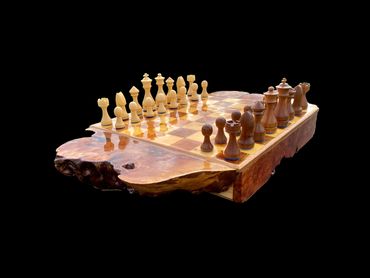 Side view of the custom chess board, showcasing the Huon Pine and Blackwood playing pieces.