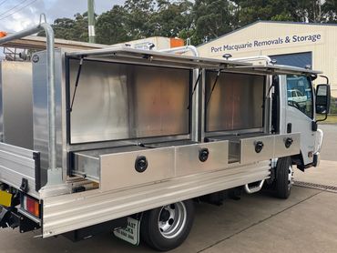 Custom builder's trailer with hinged doors and drawers