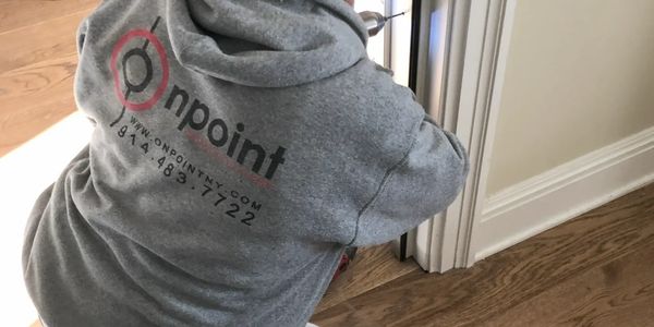 Construction worker wearing an Onpoint Construction sweater