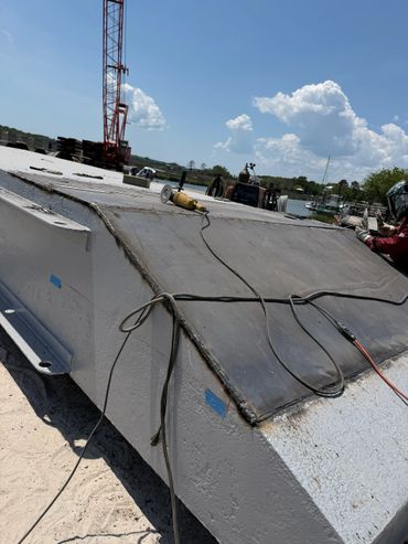 Metal sheet welding on a large industrial structure by water.