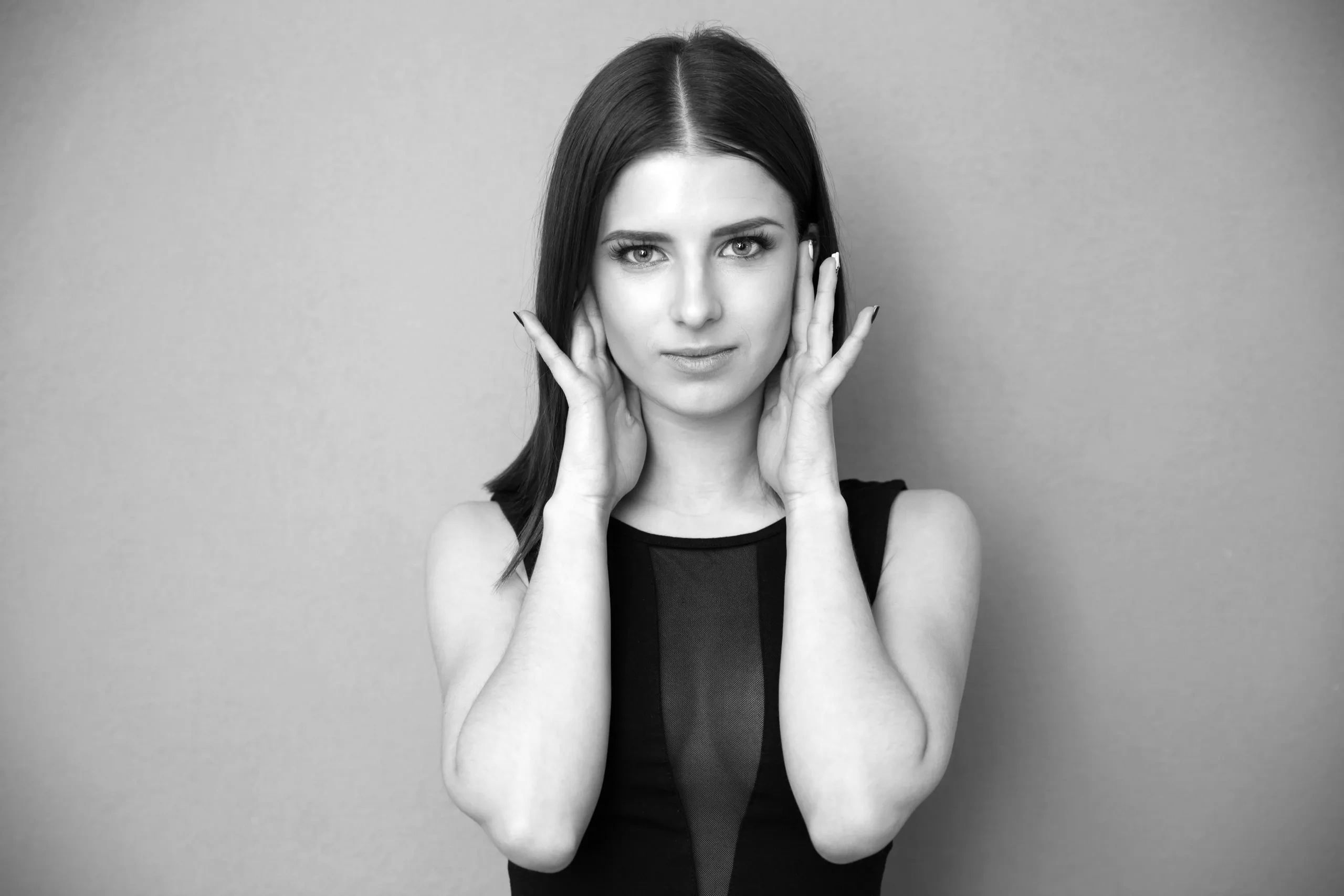 A girl with flat hair parted down the middle.