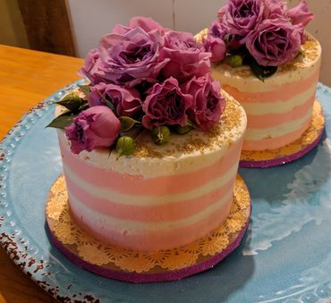 Two cakes with pink flowers