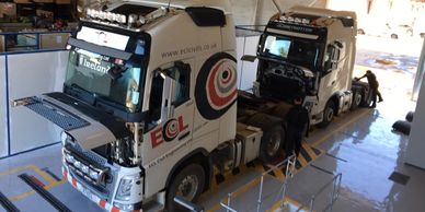 HGV vehicles in workshop ready for inspection