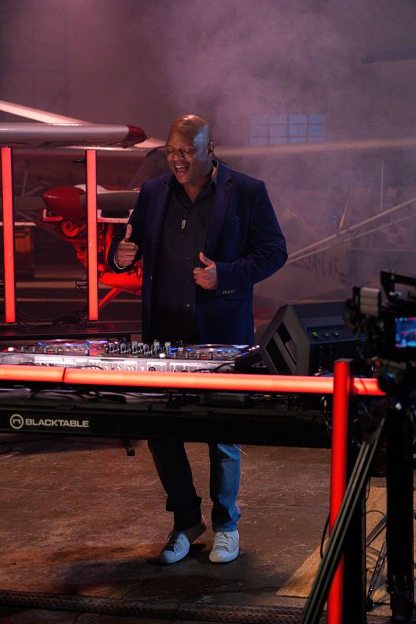 Cheerful DJ dancing during his set