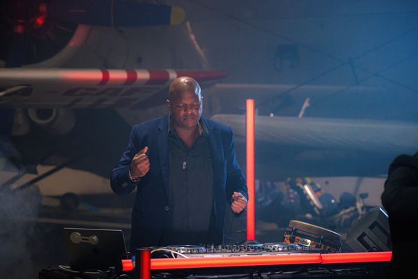 DJ dancing and playing music