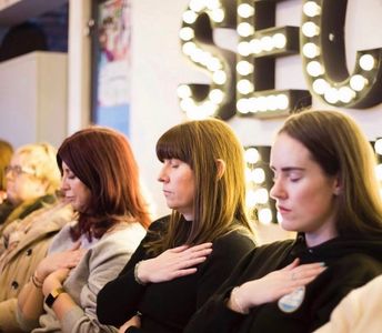 Shazney Spence SoulCoach leading a group in guided meditation.