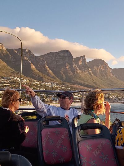 Barry and guests sitting in the Cape Town sightseeing bus