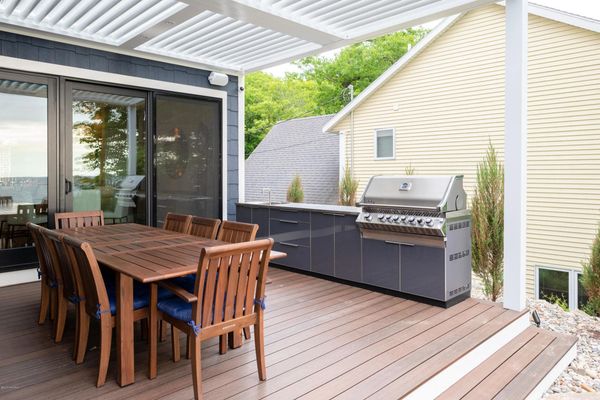 powered pergola and outdoor kitchen