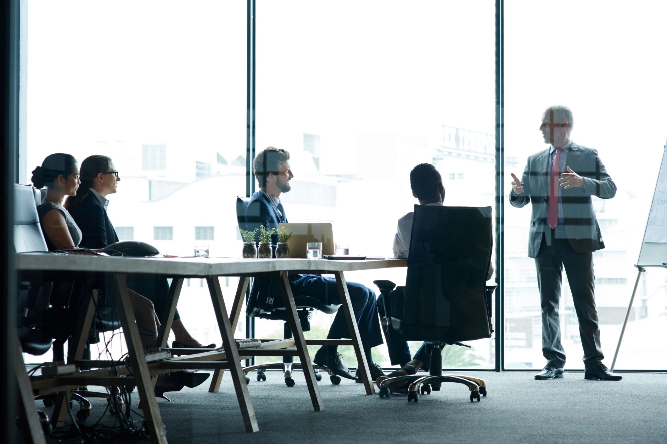 The Morrison Group style business meeting with consultants and clients.
