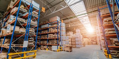 Warehouse shelves with goods representing retail and e-commerce operations.