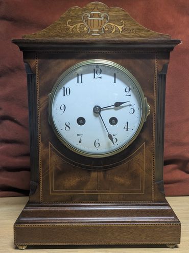 Early 20th Century French mantle clock - Mahogany case with marquetry inlay.