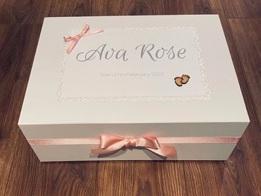 White Memory Box with wooden baby feet embellishment and Pink Ribbons & Bows, for a new born baby.
