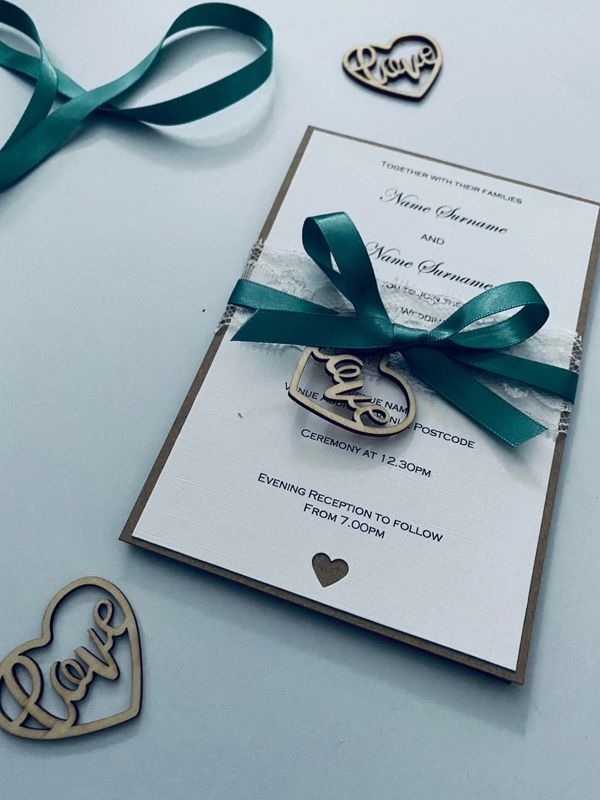 Wedding Stationery Invitation with Green Ribbon and White Lace and a Wooden Love Heart