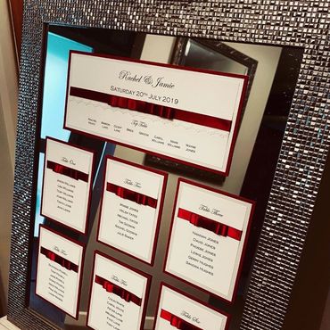 Wedding Table/Seating Plan with Red Ribbons mounted on a mirrored Silver Frame.