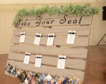 Wooden Pallet Style, Wedding Seating Plan, with white cards and navy ribbons.