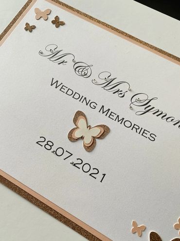 White Wedding Keepsake Box, with white & gold label and white, pink & gold butterfly embellishments.