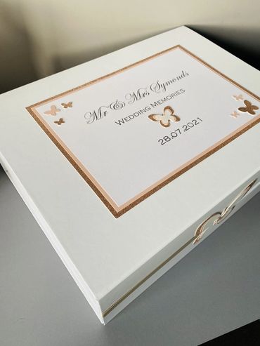 White Wedding Keepsake Box, with white & gold label and white, pink & gold butterfly embellishments.