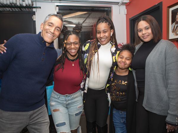4 adults and one child in photo, all smiles