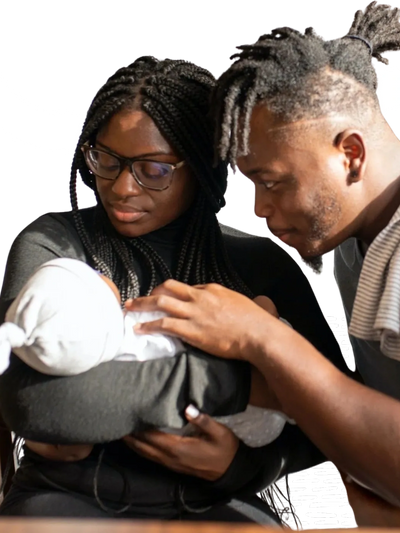 two people paying attention to newborn