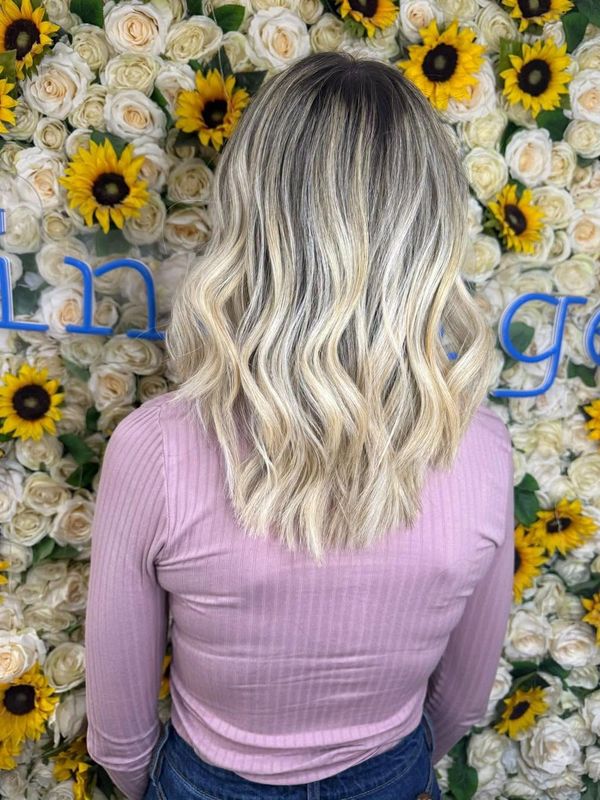 A beautiful after photo of a blonde balayage created by one of our expert team at Indulge Hairdressi