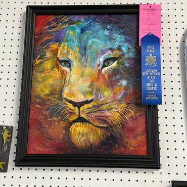 Colorful lion painting wins first place at New Mexico State Fair.