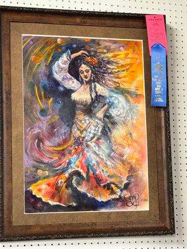Colorful painting of a flamenco dancer with flowing hair and vibrant dress.