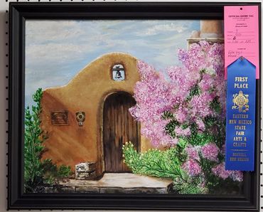 Painting of a rustic adobe building with blooming pink flowers, awarded first place at a New Mexico state fair.Lilac's in New Mexico