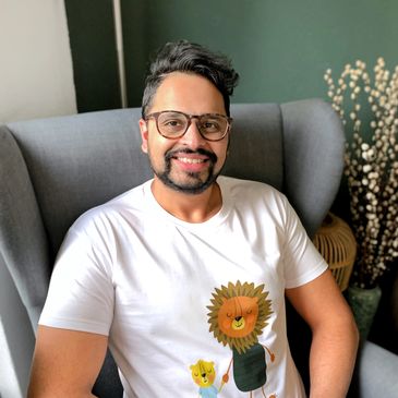 Baber the writer wearing a t-shirt with Baba Lion and Little Lion