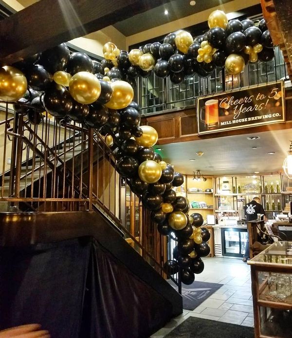 Black and Gold Balloon Garland on Stair case