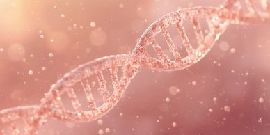 Close-up of a DNA double helix structure with a soft pink background.
