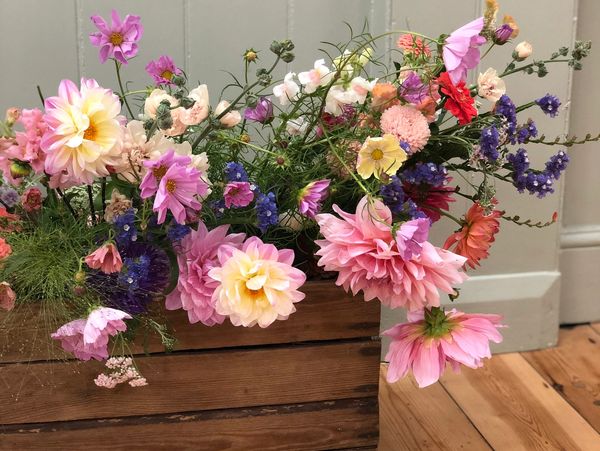 A wooden crate with flowers