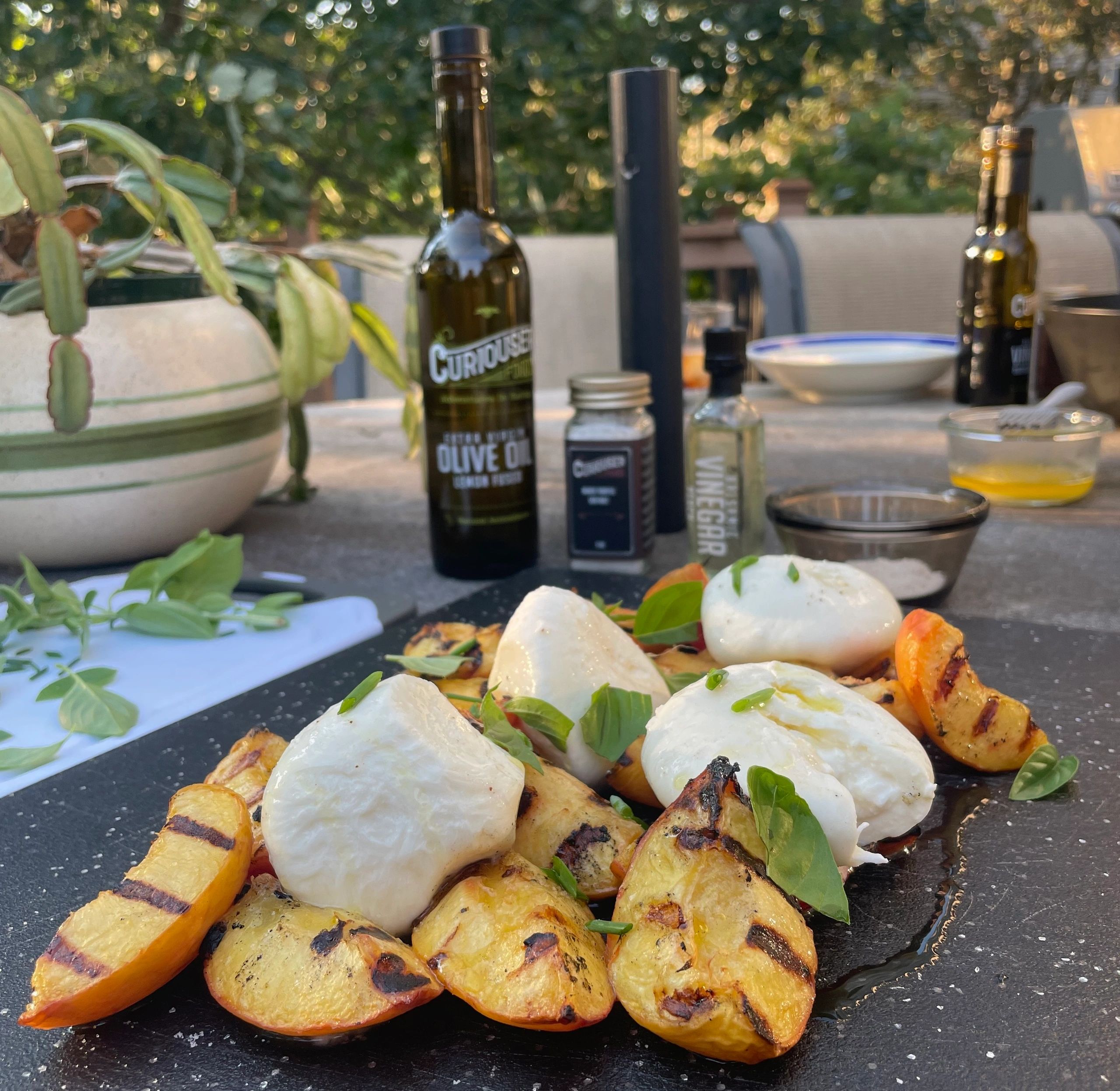 Grilled peaches with burrata and fresh basil.