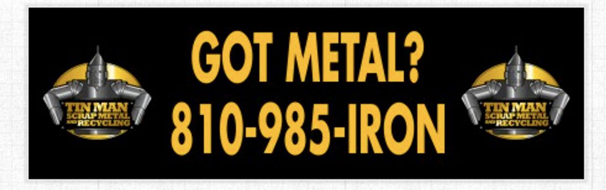 Advertisement banner for Tin Man Scrap Metal & Recycling with contact number.