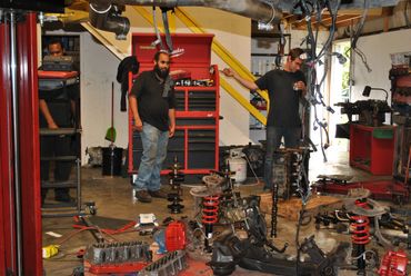 Chris and Alex looking at the parts that will be put on a 2000 Chevrolet Camaro Z28 SS 5.7L V8.